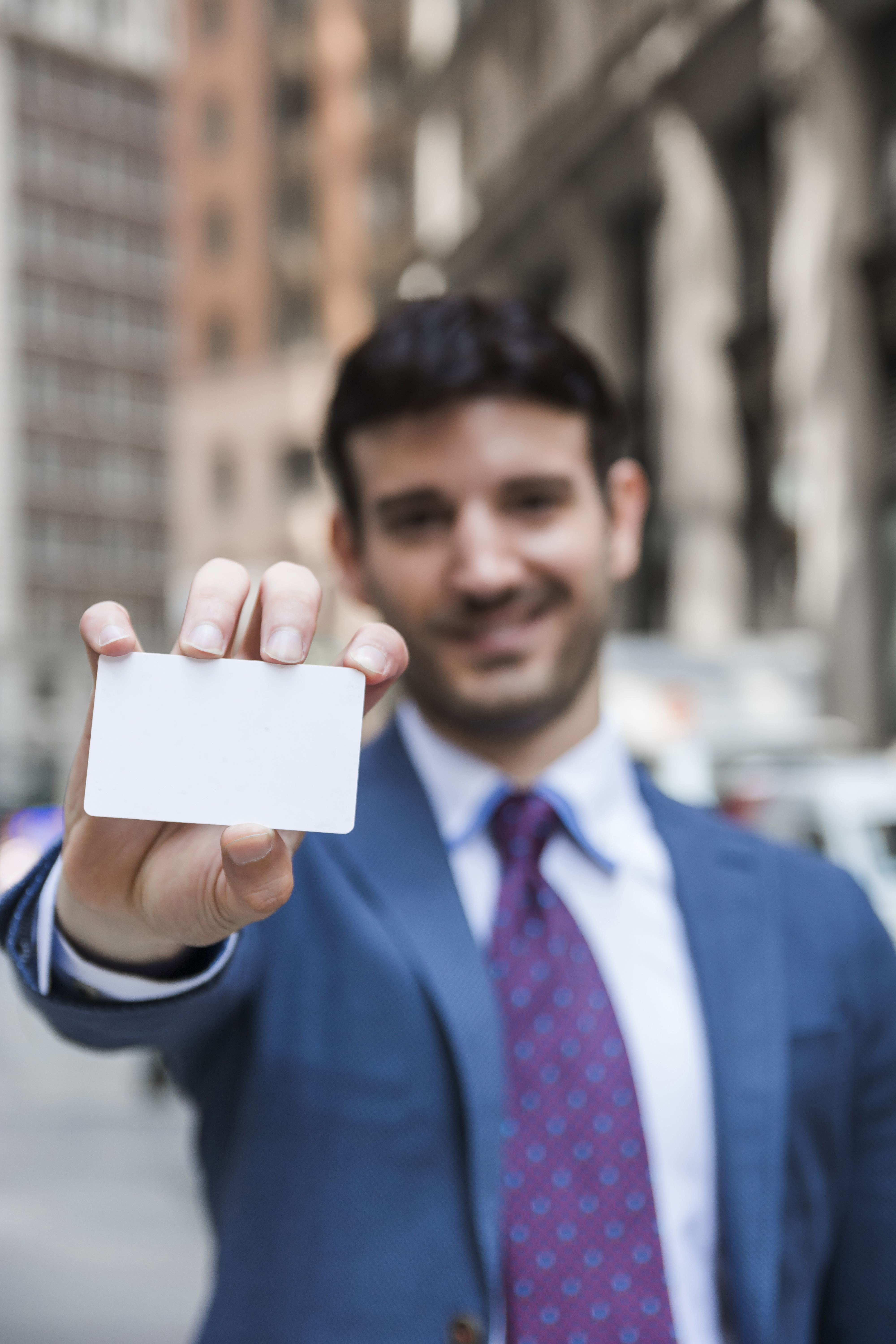 blurred-businessman-demonstrating-visiting-card.jpg